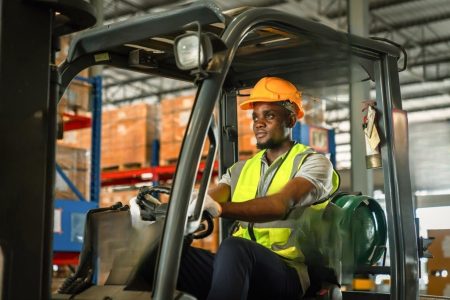 stock-photo-african-forklift-driver-focused-on-carefully-transporting-stock-from-shelves-of-a-large-warehouse-2407325401-transformed